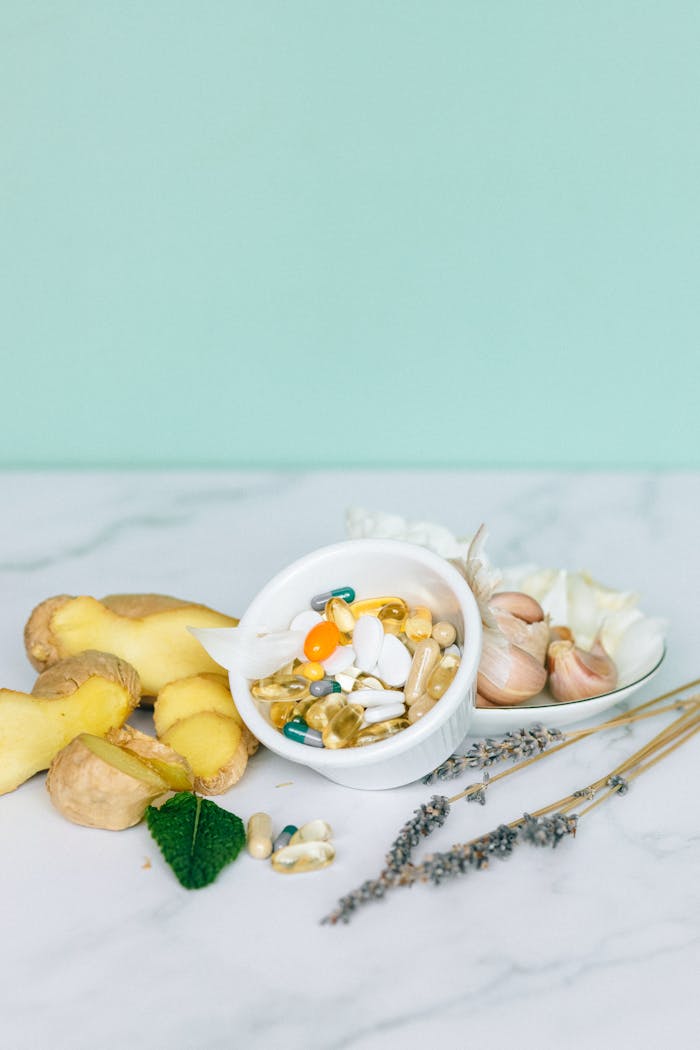 A selection of natural supplements featuring ginger, garlic, and herbs for holistic health benefits.